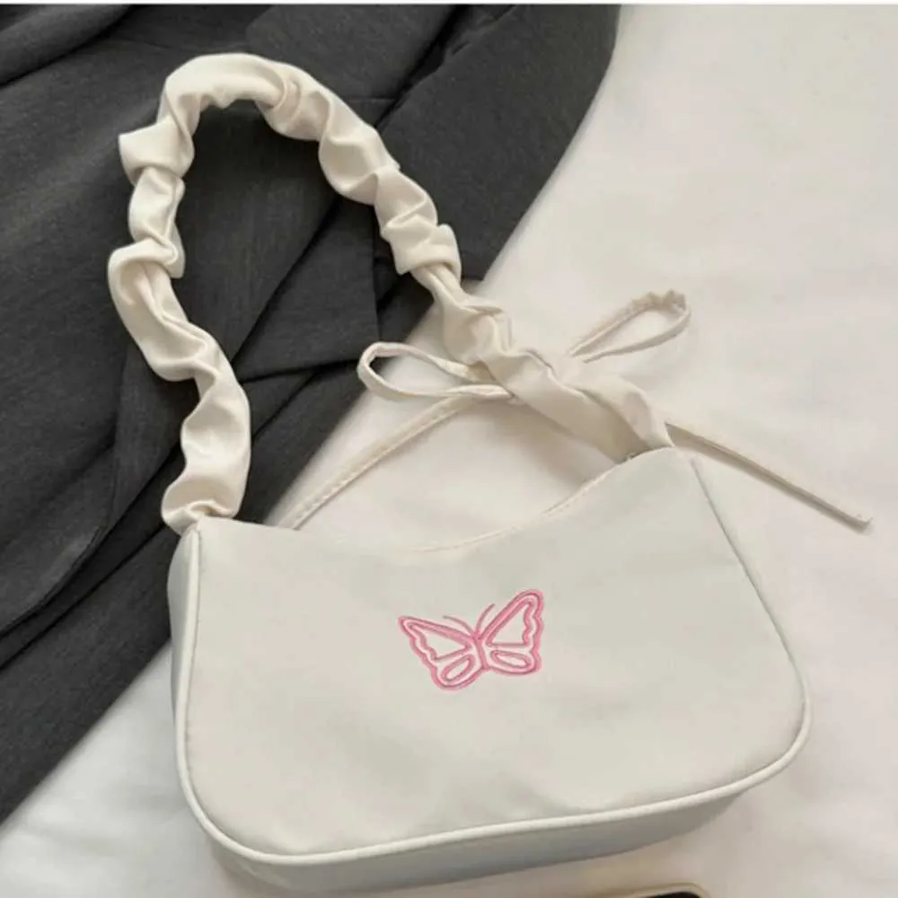 Tikand Bowknot Shoder Bag Y2k stiilis volangidega käepide Nyl Bow meigipulga kott käekott Y241026_voghion.com