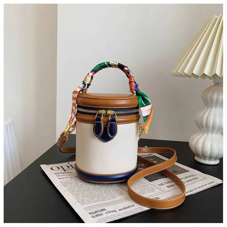 Borsa a secchiello in tela beige borsa a tracolla e a mano_voghion.com