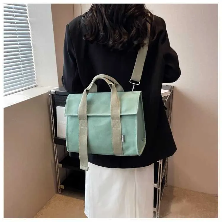 Stor axelremsväska i canvas och crossbody för damer_voghion.com