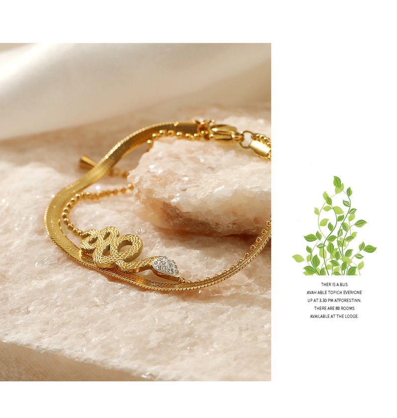 Braccialetto alla moda in acciaio inox a doppio strato, stile retrò etnico, incastonato in oro, in titanio placcato in oro, con catena a forma di serpente e osso, da donna_voghion.com