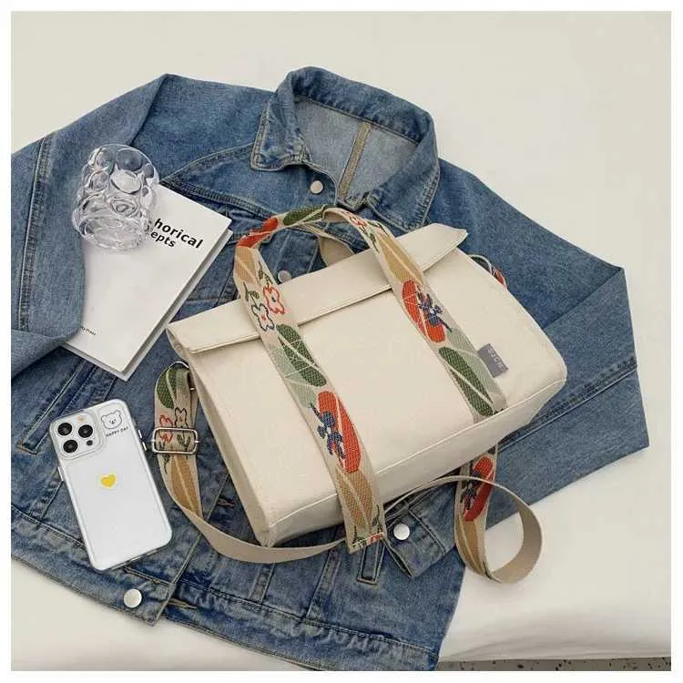 Stor axelremsväska i canvas och crossbody för damer_voghion.com