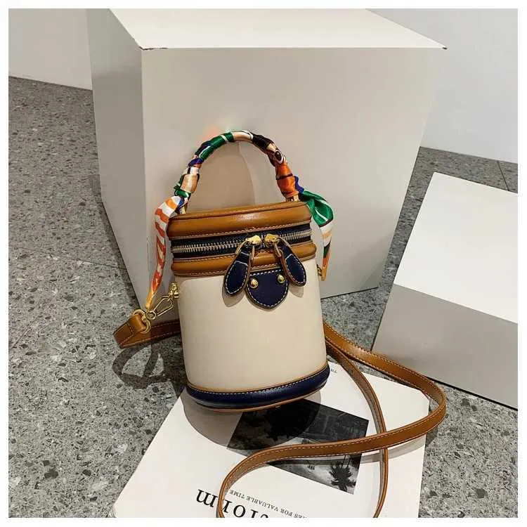 Borsa a secchiello in tela beige borsa a tracolla e a mano_voghion.com
