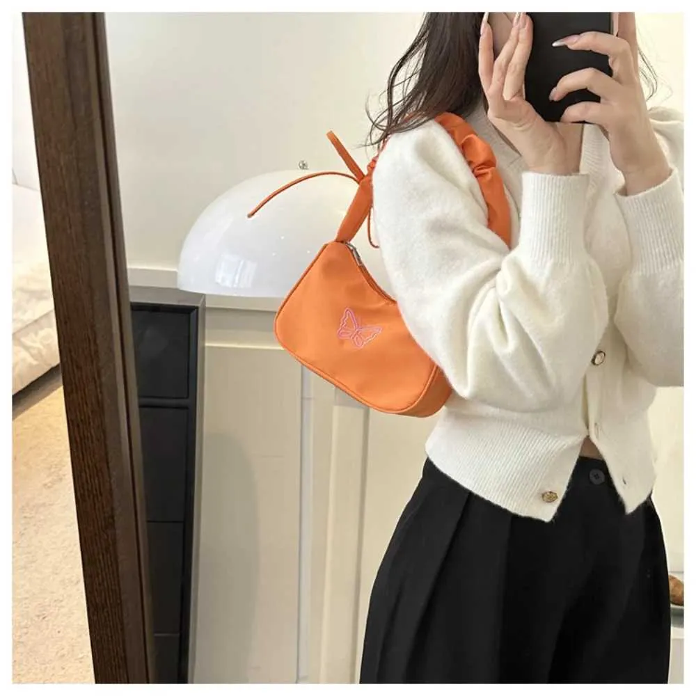 Tikand Bowknot Shoder Bag Y2k stiilis volangidega käepide Nyl Bow meigipulga kott käekott Y241026_voghion.com