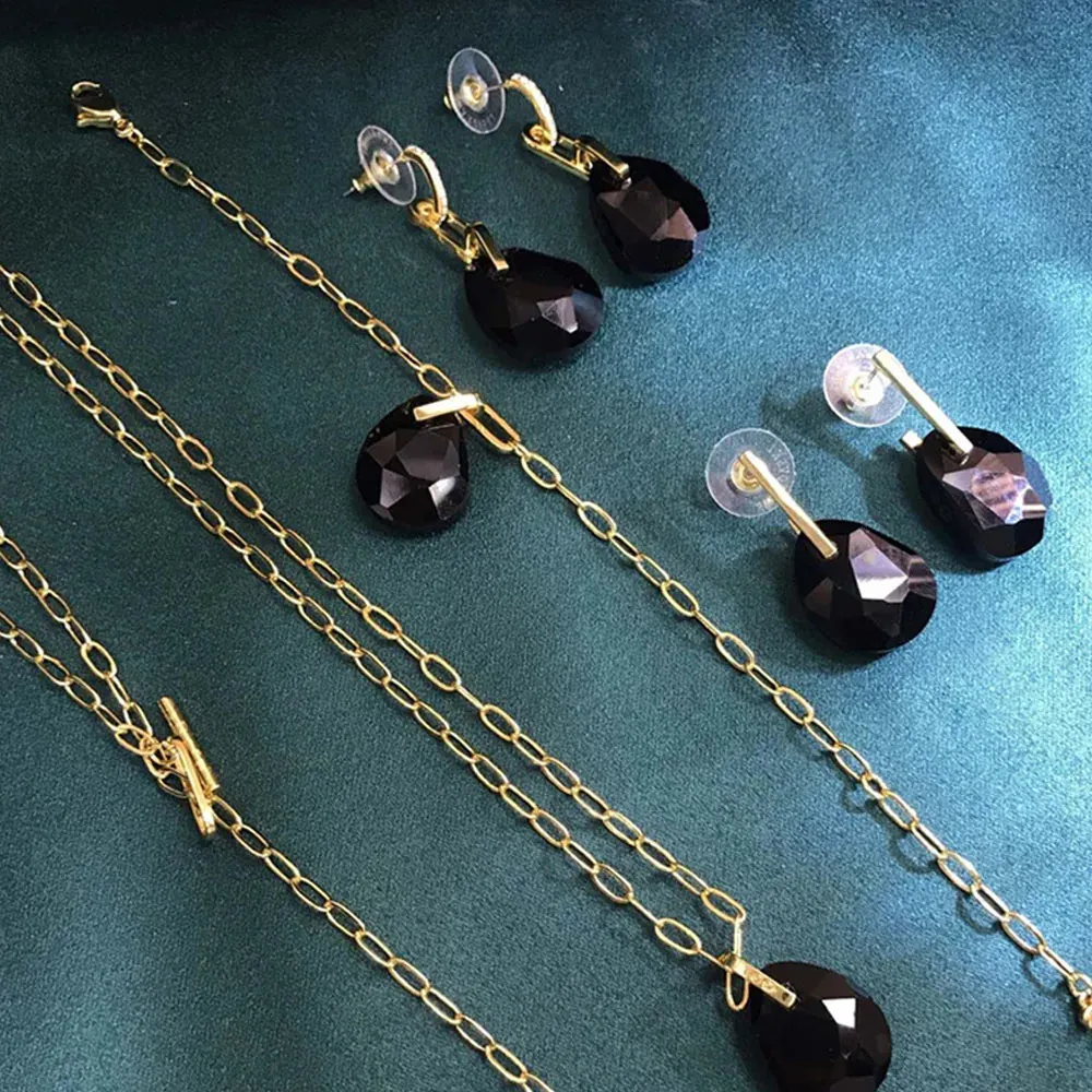 Set gioielli con collana e orecchini a goccia in cristallo rosso_voghion.com
