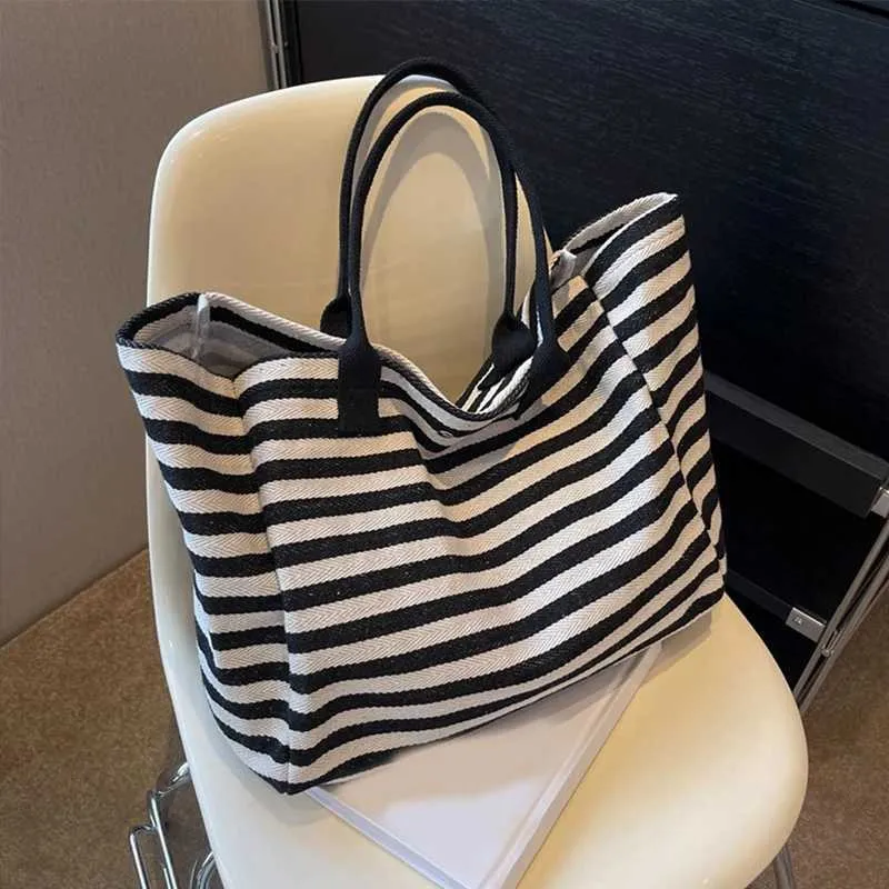 Borse da shopping in tela da donna, design a strisce alla moda e semplice per ragazze, borse di alta qualità Y241109_voghion.com