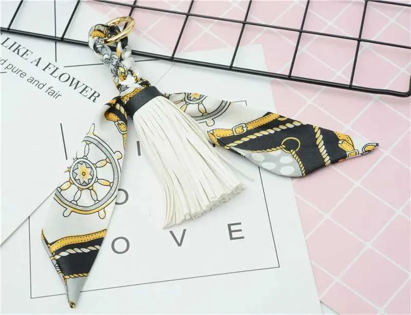 Pingente de lenço com borla de couro macio e fofo, acessório para bolsa, novo chaveiro, porta-chaves de carro da moda K1690 Y241121_voghion.com