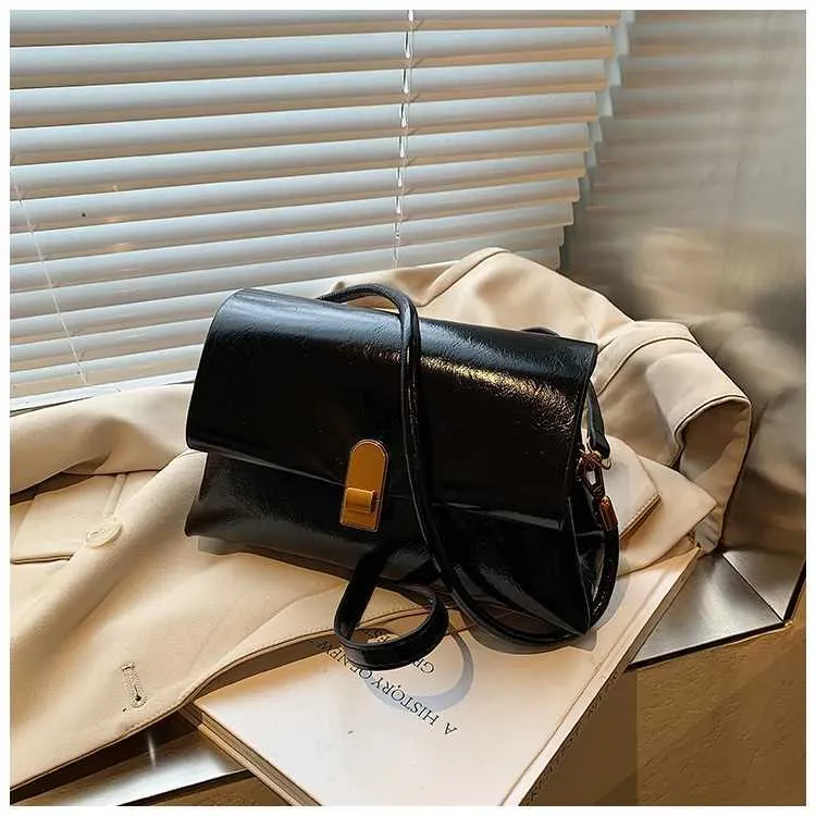 Strukturerad axelremsväska och crossbody väska för damer_voghion.com