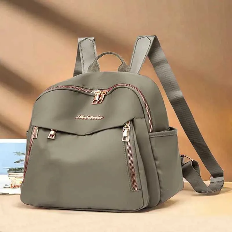 Sac à dos tendance en nylon imperméable à fermeture éclair de grande capacité avec filetage 2024 Hot Selg Sac polyvalent pour femme Mochila Mujer Y241116_voghion.com