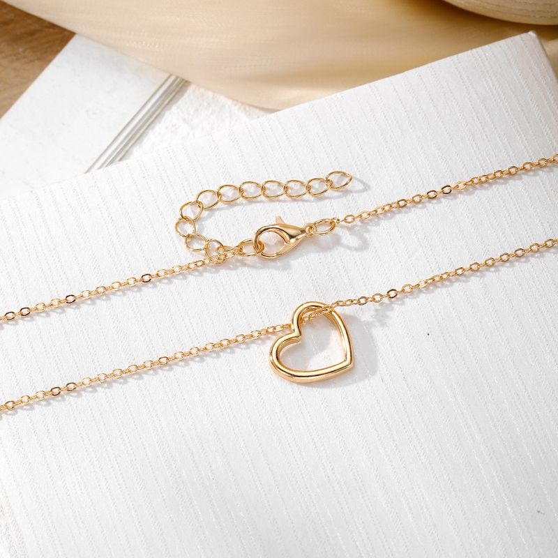 Liebesanhänger Halskette für Frauen hohler Stil hochwertiger Sinn für alle Spielpullover Schlüsselbeinkette Schmuck_voghion.com