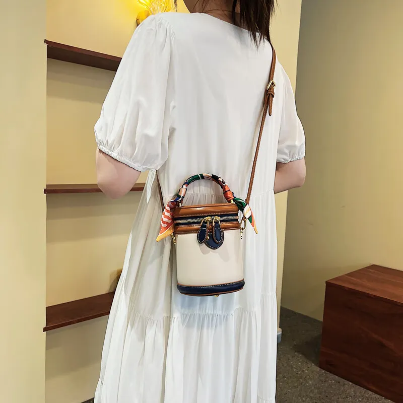Neue, von einem Nischendesigner entworfene zylindrische Tasche, eine Retro- und modische Umhängetasche für Damen_voghion.com
