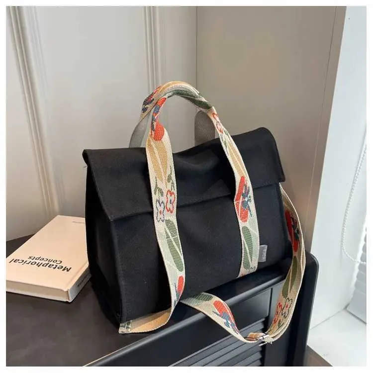 Stor axelremsväska i canvas och crossbody för damer_voghion.com