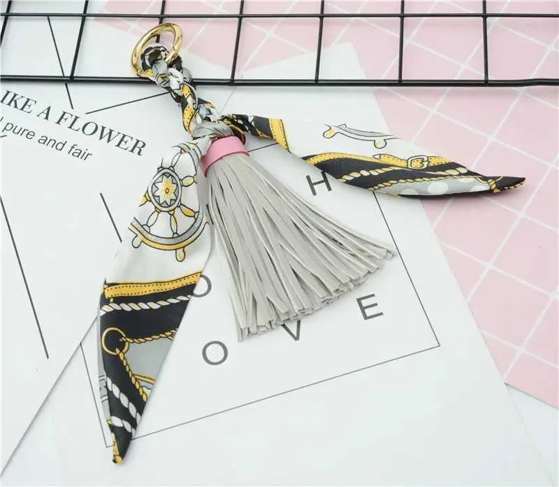 Pingente de lenço com borla de couro macio e fofo, acessório para bolsa, novo chaveiro, porta-chaves de carro da moda K1690 Y241121_voghion.com