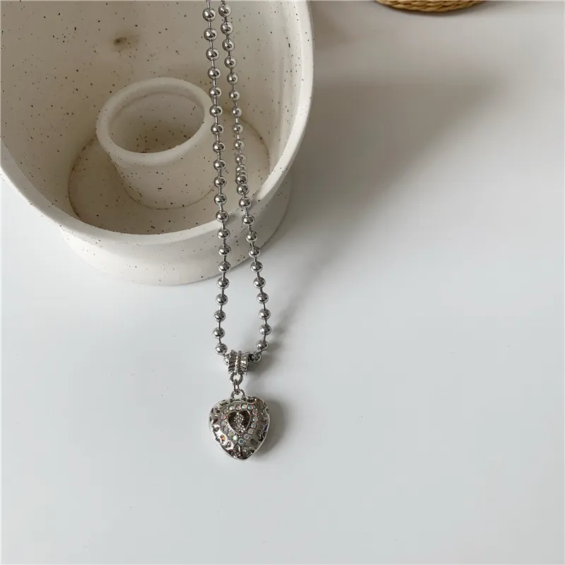Collana con pendente a cuore e angelo da donna con strass e chiusura_voghion.com