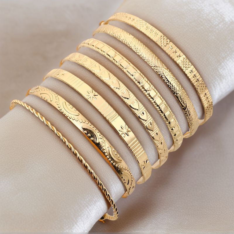 Retro Personality Exaggerated Wide Gold Glossy Multi Element Set Bracelet_voghion.com