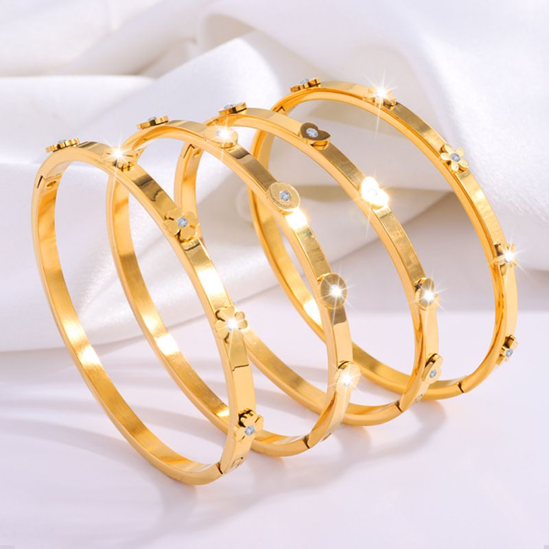 Bracciale rigido in acciaio al titanio e zircone a forma di cuore rotondo stile IG, in blocco_voghion.com