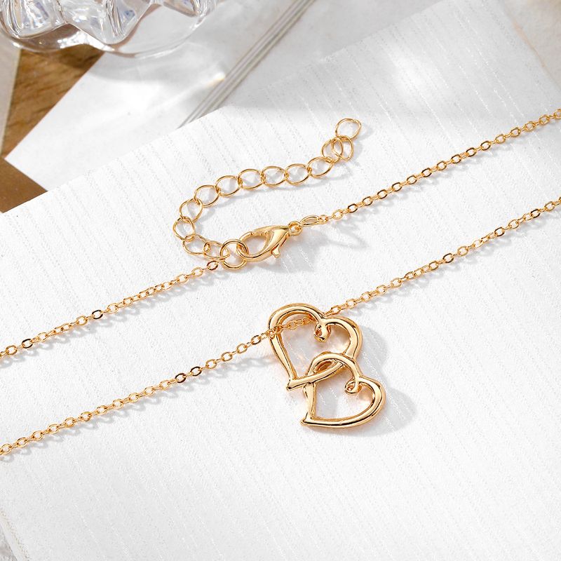 Liebesanhänger Halskette für Frauen hohler Stil hochwertiger Sinn für alle Spielpullover Schlüsselbeinkette Schmuck_voghion.com