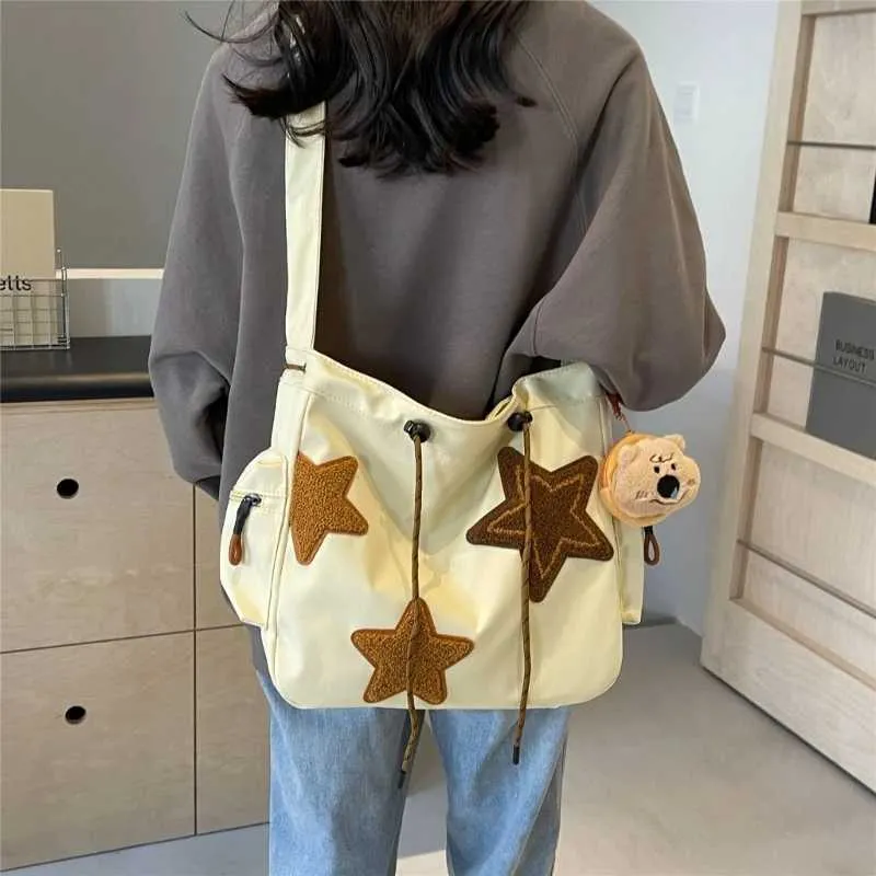 Borsa a tracolla a forma di stella in tela da donna, zaino per studenti Y241116_voghion.com