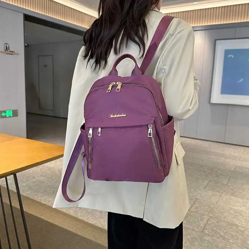 Sac à dos tendance en nylon imperméable à fermeture éclair de grande capacité avec filetage 2024 Hot Selg Sac polyvalent pour femme Mochila Mujer Y241116_voghion.com