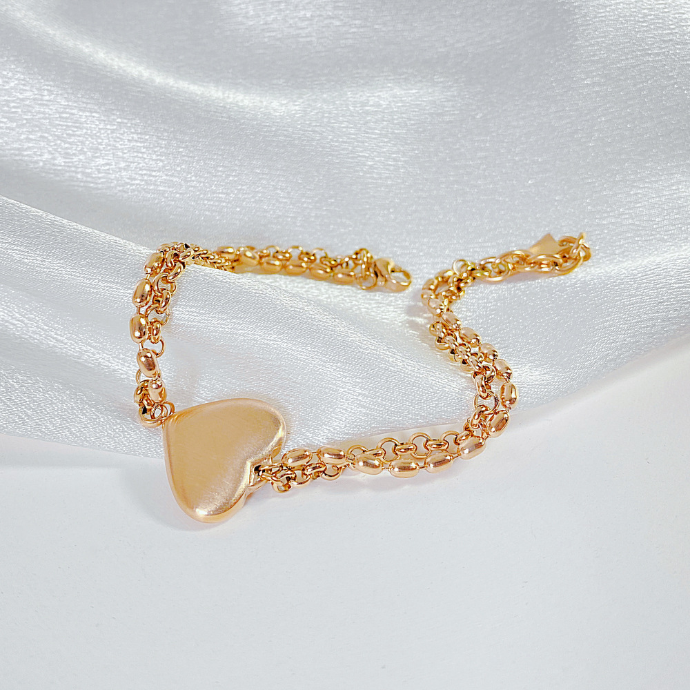 Bracciale da donna con cuore color pesca in acciaio al titanio e stile amore semplice_voghion.com