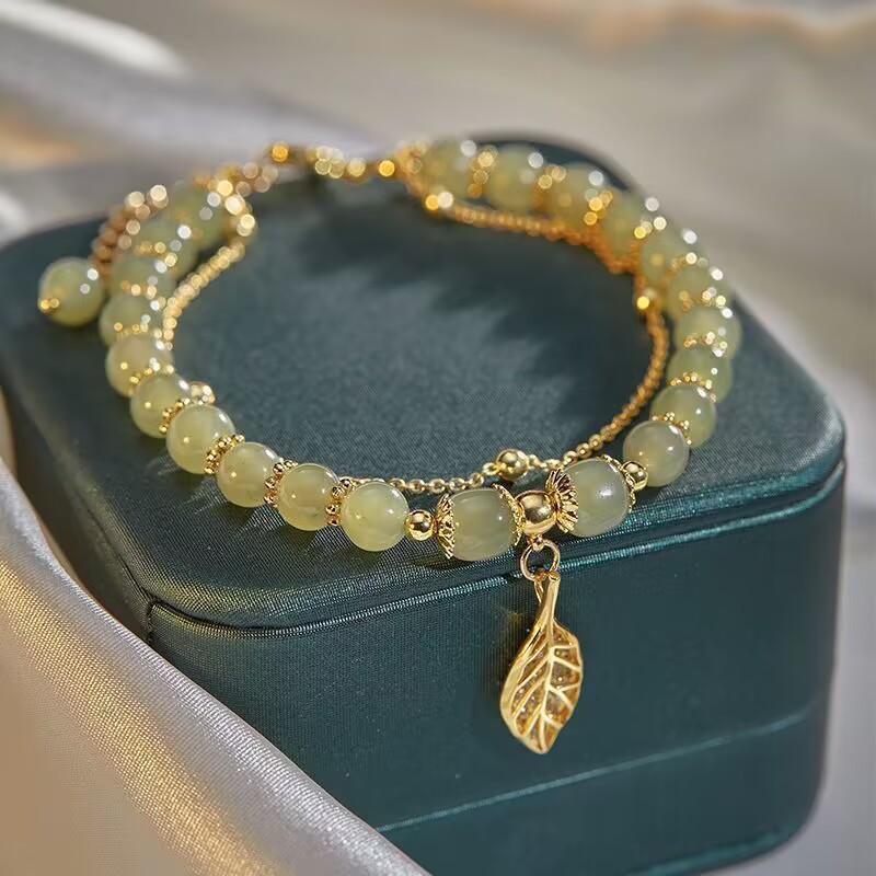 Pulsera de cuentas esmaltadas con hojas de jade y ramas doradas de alta gama de moda nueva Pulsera de lujo ligera Mori Niche creativa transfronteriza para mujer