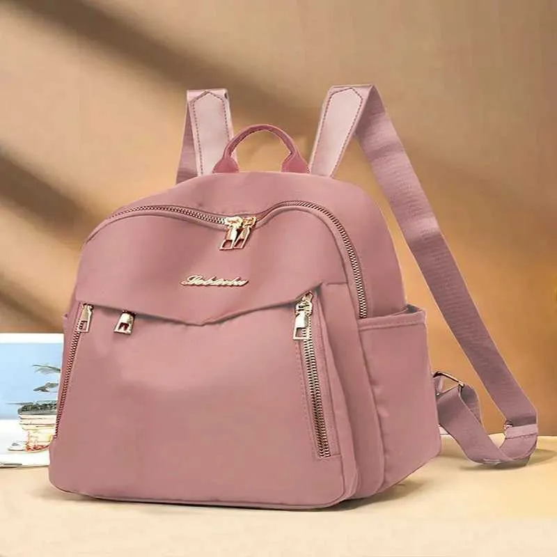 Sac à dos tendance en nylon imperméable à fermeture éclair de grande capacité avec filetage 2024 Hot Selg Sac polyvalent pour femme Mochila Mujer Y241116_voghion.com