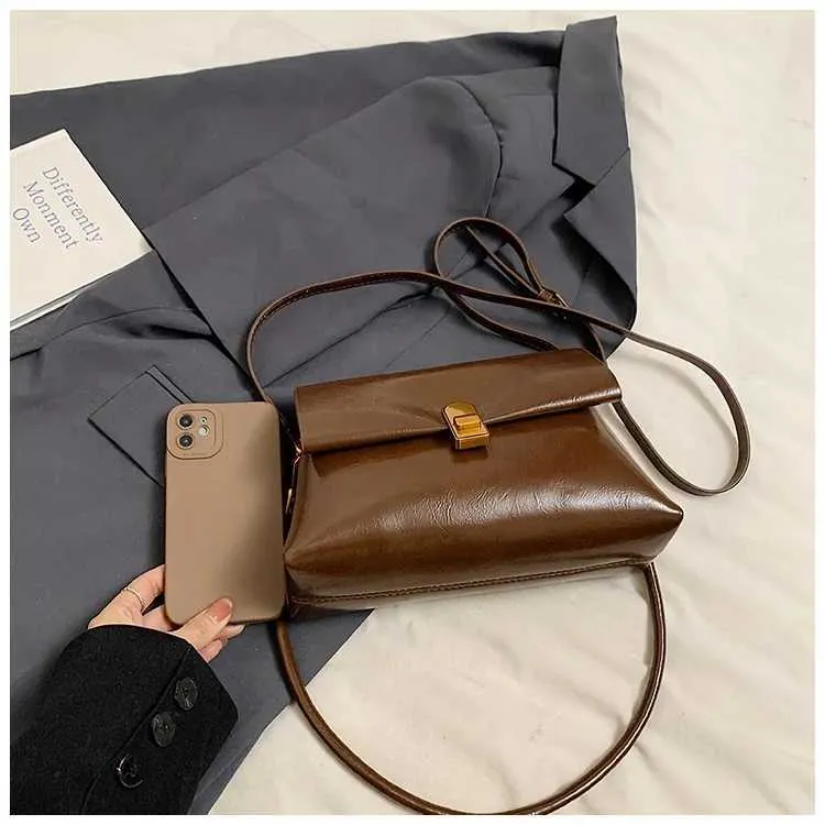 Strukturerad axelremsväska och crossbody väska för damer_voghion.com