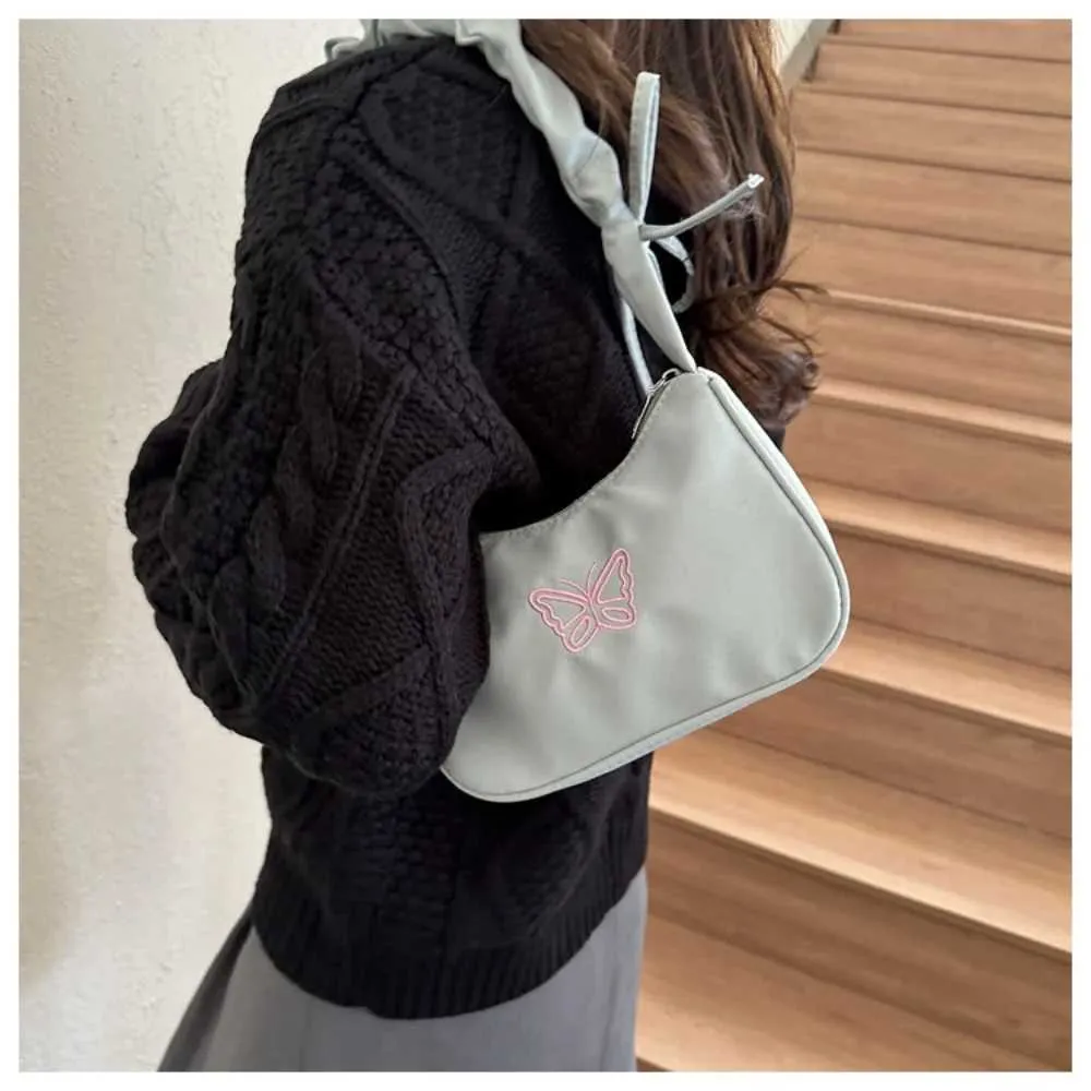 Tikand Bowknot Shoder Bag Y2k stiilis volangidega käepide Nyl Bow meigipulga kott käekott Y241026_voghion.com