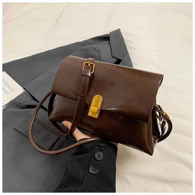 Strukturerad axelremsväska och crossbody väska för damer_voghion.com