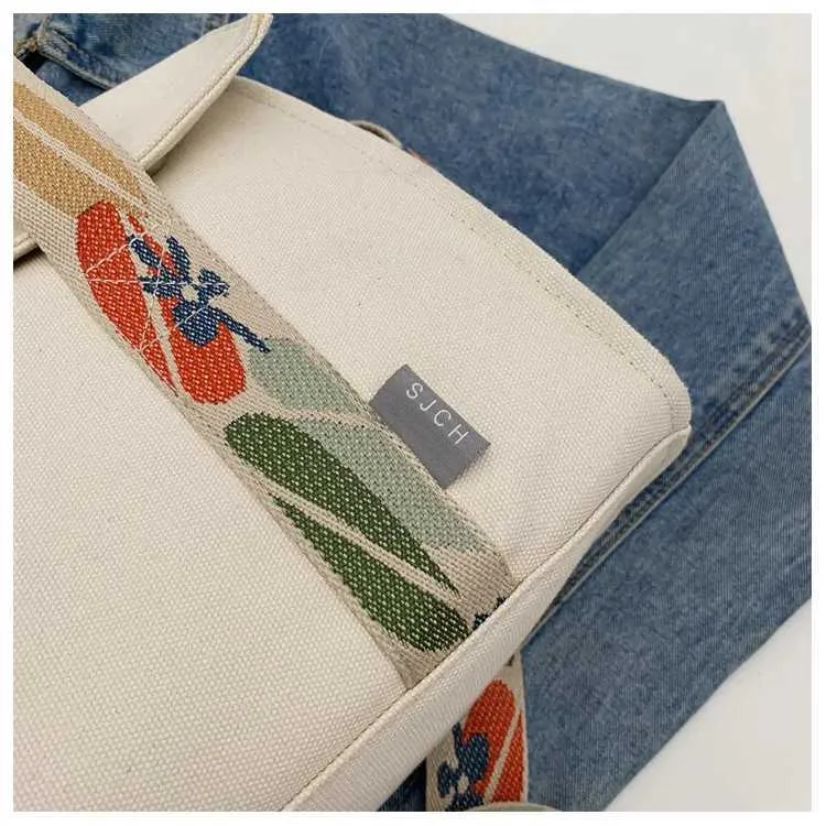 Stor axelremsväska i canvas och crossbody för damer_voghion.com