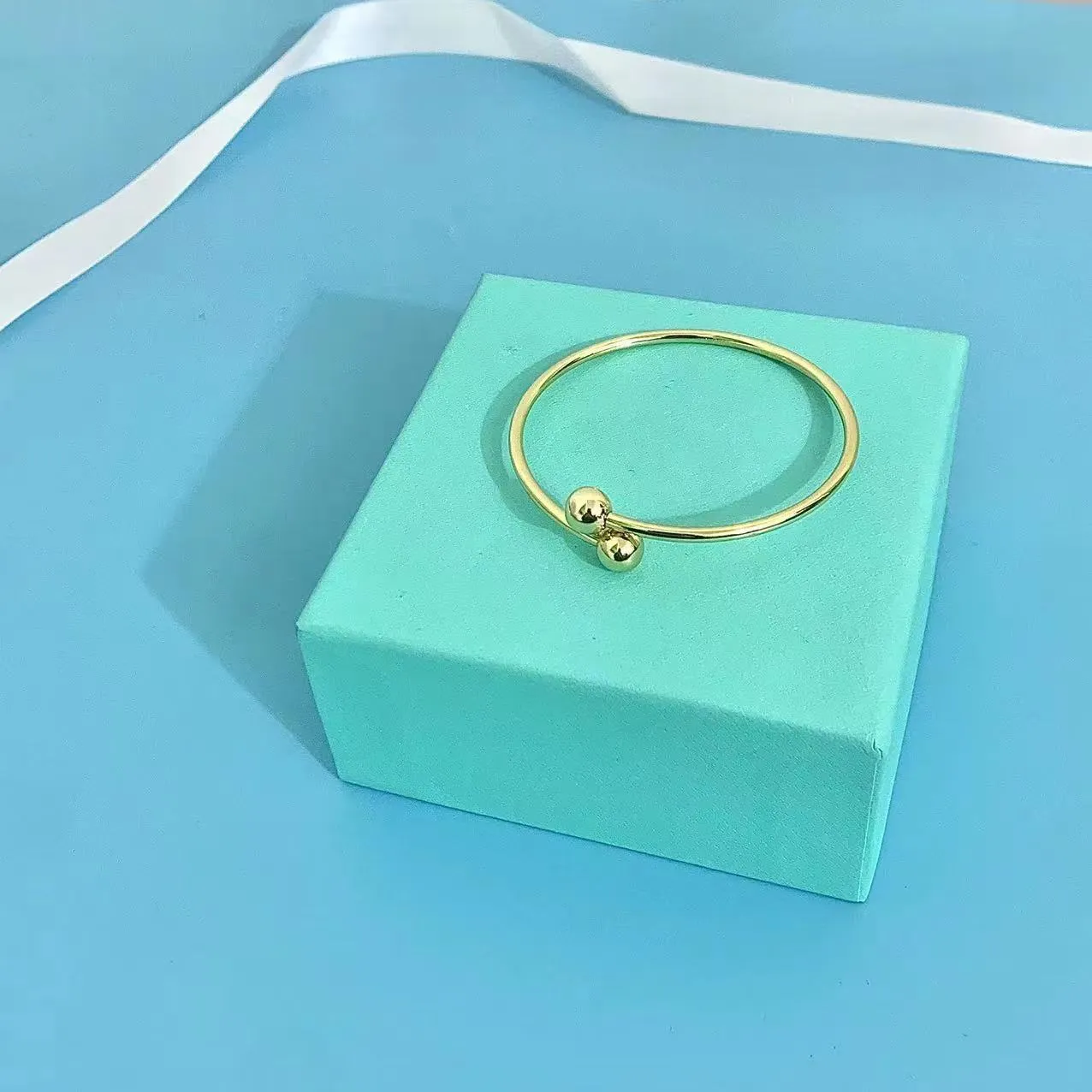 Bracciale rigido lotus elegante da donna placcato oro e argento_voghion.com