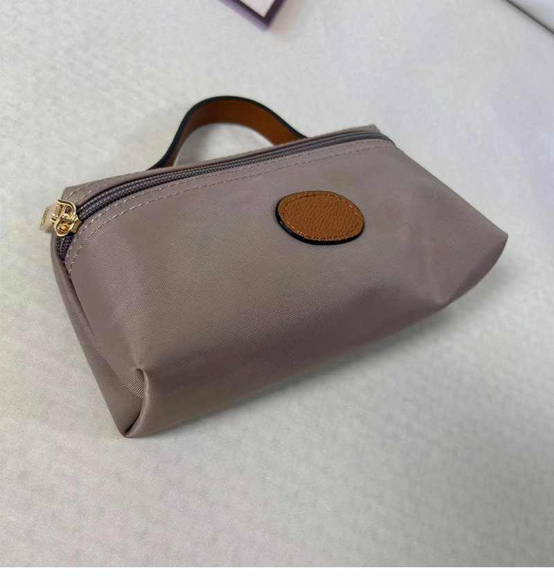 2024 nuova mini borsa per cosmetici portatile alla moda, portamonete per gnocchi alla moda, in nylon femminile, impermeabile e leggero_voghion.com