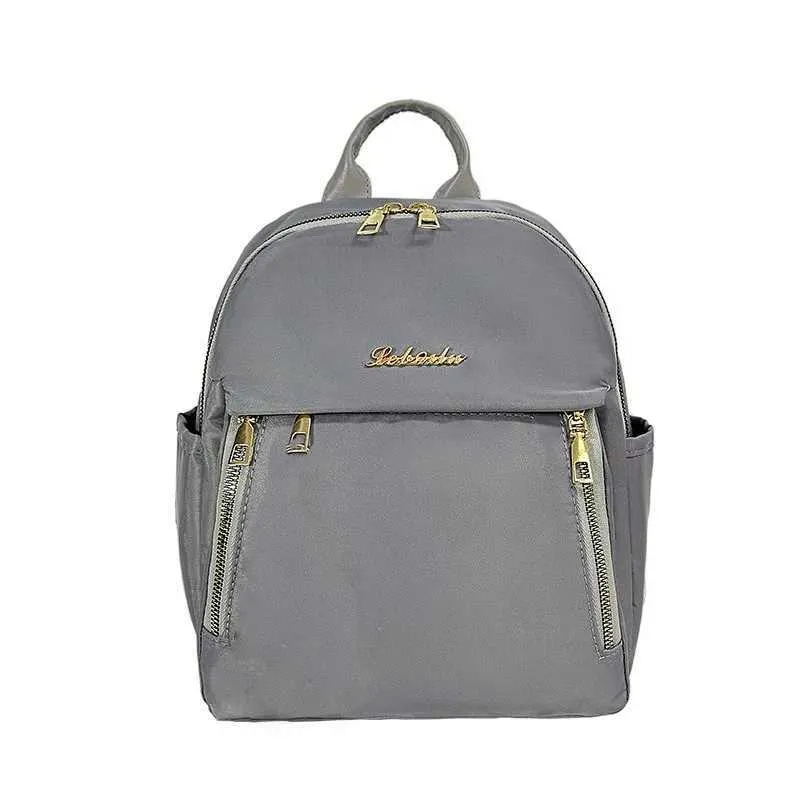 Sac à dos tendance en nylon imperméable à fermeture éclair de grande capacité avec filetage 2024 Hot Selg Sac polyvalent pour femme Mochila Mujer Y241116_voghion.com