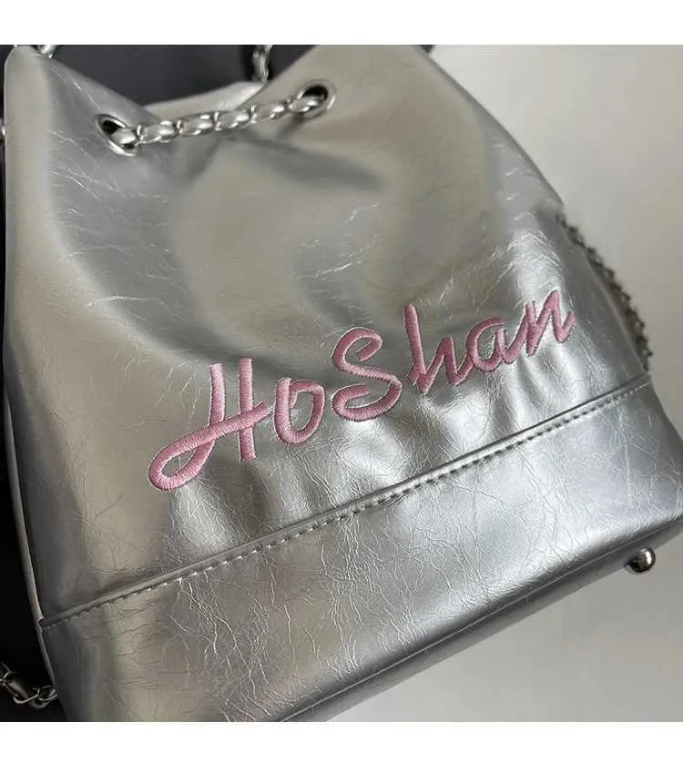 Borsa a secchiello in pelle da donna con ricamo e tracolla_voghion.com