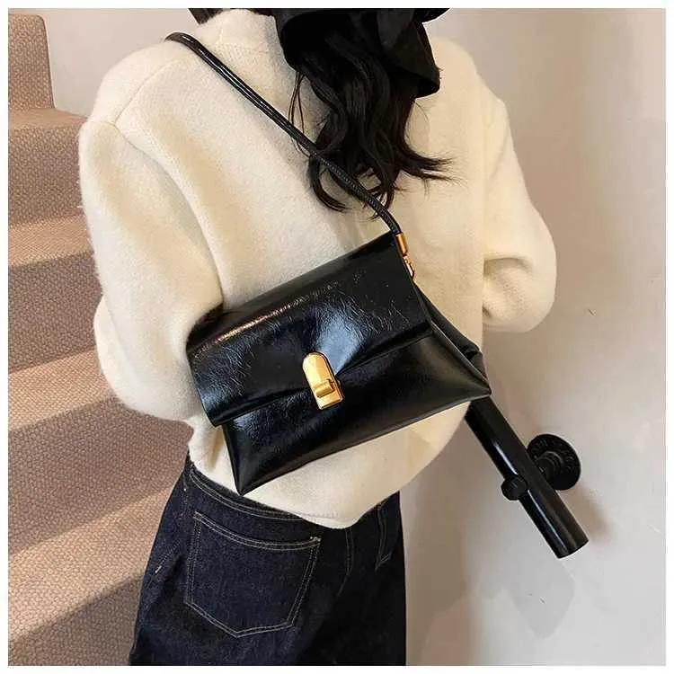 Strukturerad axelremsväska och crossbody väska för damer_voghion.com