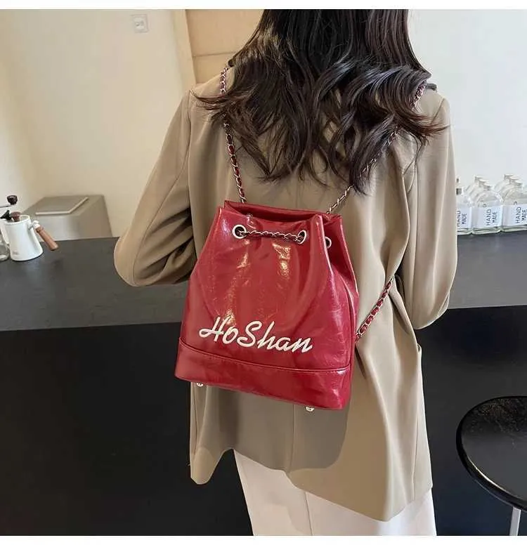 Borsa a secchiello in pelle da donna con ricamo e tracolla_voghion.com