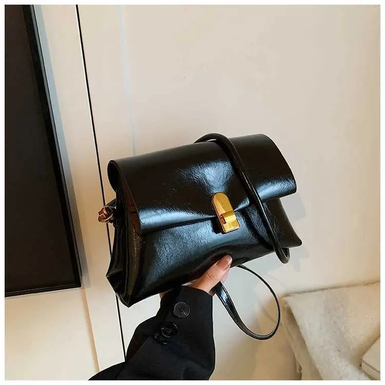Strukturerad axelremsväska och crossbody väska för damer_voghion.com