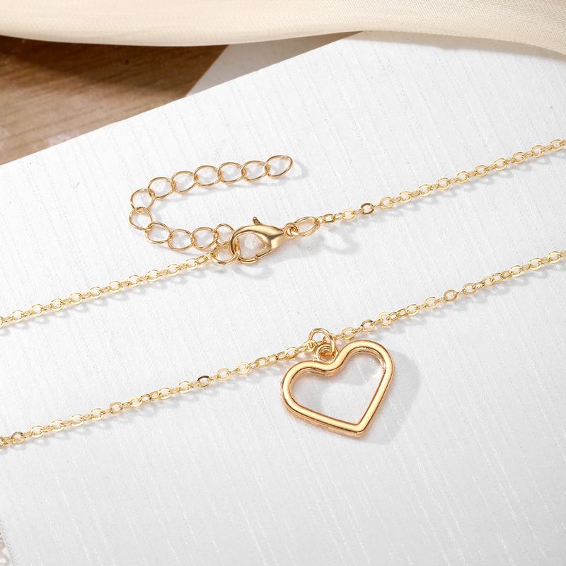 Liebesanhänger Halskette für Frauen hohler Stil hochwertiger Sinn für alle Spielpullover Schlüsselbeinkette Schmuck_voghion.com