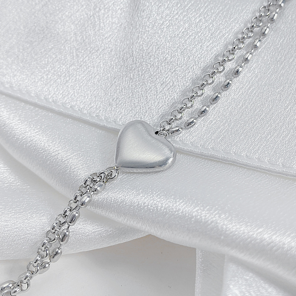 Bracciale da donna con cuore color pesca in acciaio al titanio e stile amore semplice_voghion.com