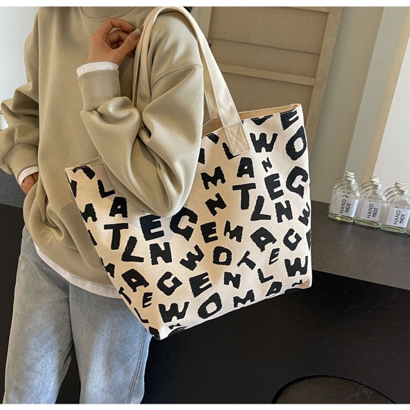 Persönlichkeit bedruckter Buchstabe Mommy Bag 2024 neue Textur Farbkontrast Freizeit Canvas große Kapazität Tote_voghion.com