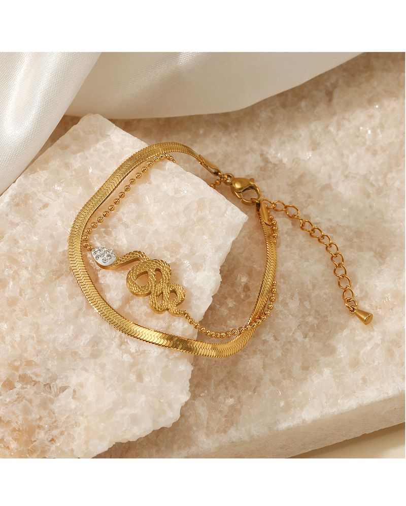 Braccialetto alla moda in acciaio inox a doppio strato, stile retrò etnico, incastonato in oro, in titanio placcato in oro, con catena a forma di serpente e osso, da donna_voghion.com
