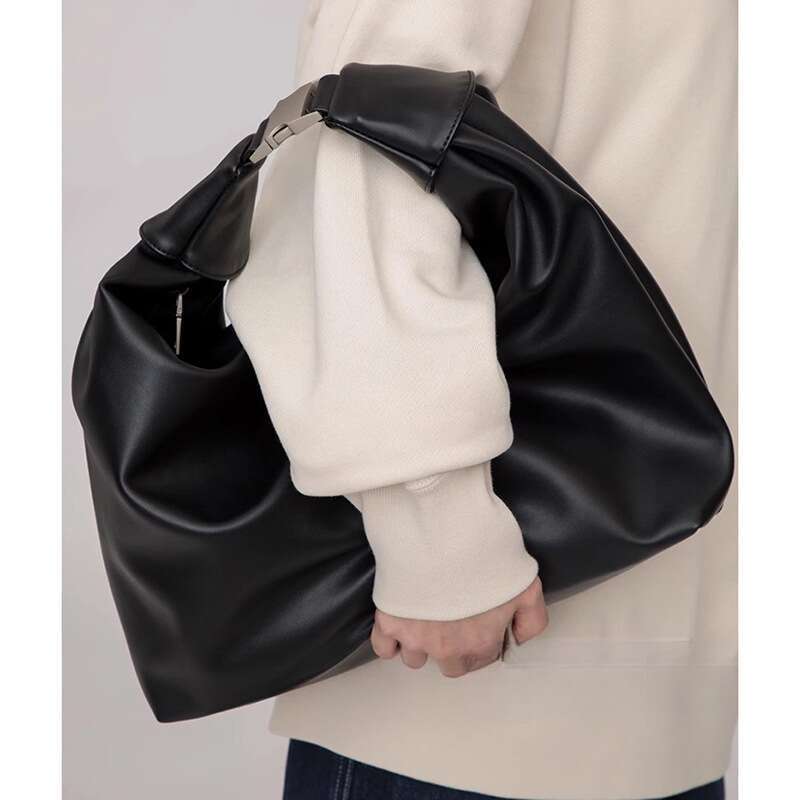 Versione coreana della borsa in morbida pelle a forma di gnocco, nuova borsa da uomo Hundred 2025, borsa da pendolare in tinta unita_voghion.com