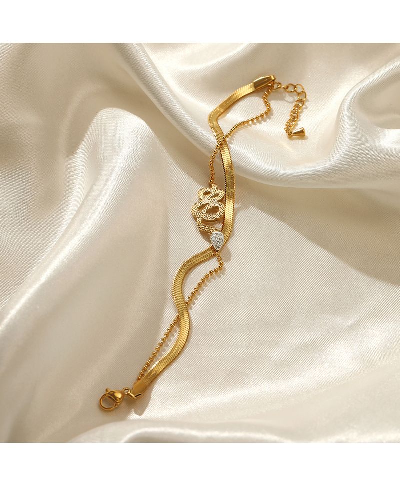 Braccialetto alla moda in acciaio inox a doppio strato, stile retrò etnico, incastonato in oro, in titanio placcato in oro, con catena a forma di serpente e osso, da donna_voghion.com