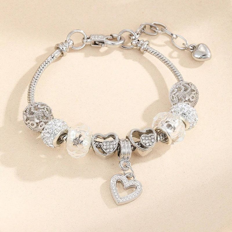 Bracciale staccabile fai da te con perline a foro grande in cristallo di Pan con cuore cavo e intarsio dia_voghion.com