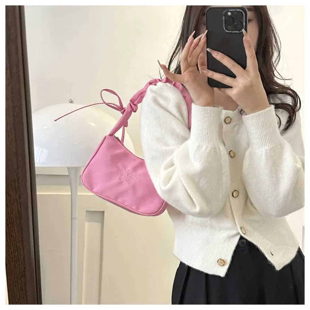 Tikand Bowknot Shoder Bag Y2k stiilis volangidega käepide Nyl Bow meigipulga kott käekott Y241026_voghion.com