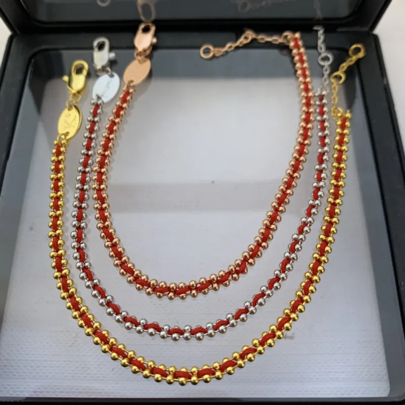 2024 Nueva pulsera de cuerda torcida tejida de la suerte con revestimiento francés caliente Pulseras de oro Brazalete Joyería_voghion.com