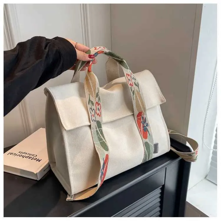 Stor axelremsväska i canvas och crossbody för damer_voghion.com