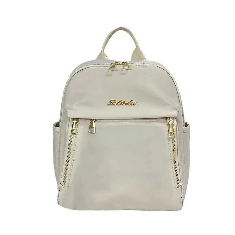 Sac à dos tendance en nylon imperméable à fermeture éclair de grande capacité avec filetage 2024 Hot Selg Sac polyvalent pour femme Mochila Mujer Y241116_voghion.com