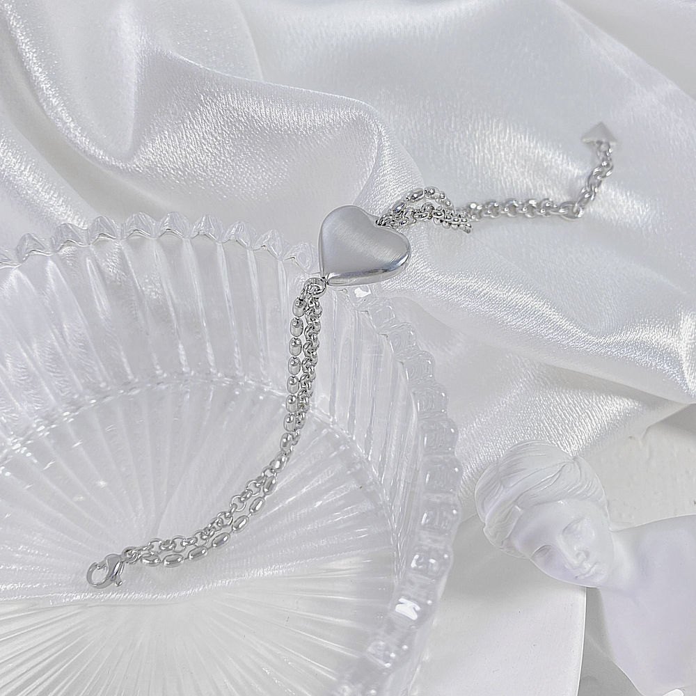 Bracciale da donna con cuore color pesca in acciaio al titanio e stile amore semplice_voghion.com