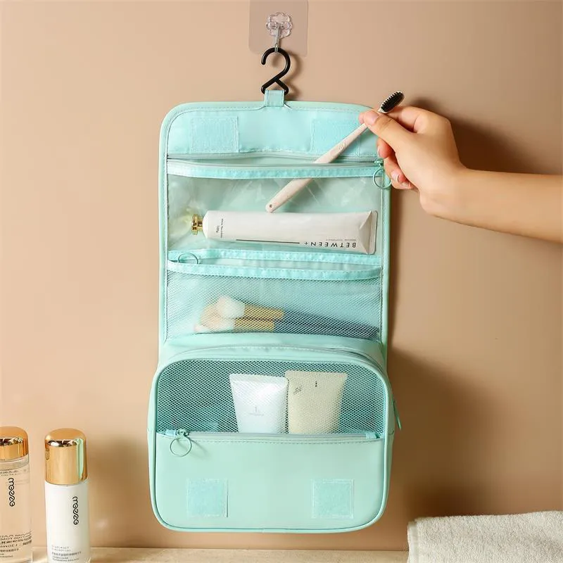 Trousse de maquillage portable de grande capacité avec crochet pour ranger les produits cosmétiques et les articles de toilette, idéale pour les voyages et les affaires._voghion.com