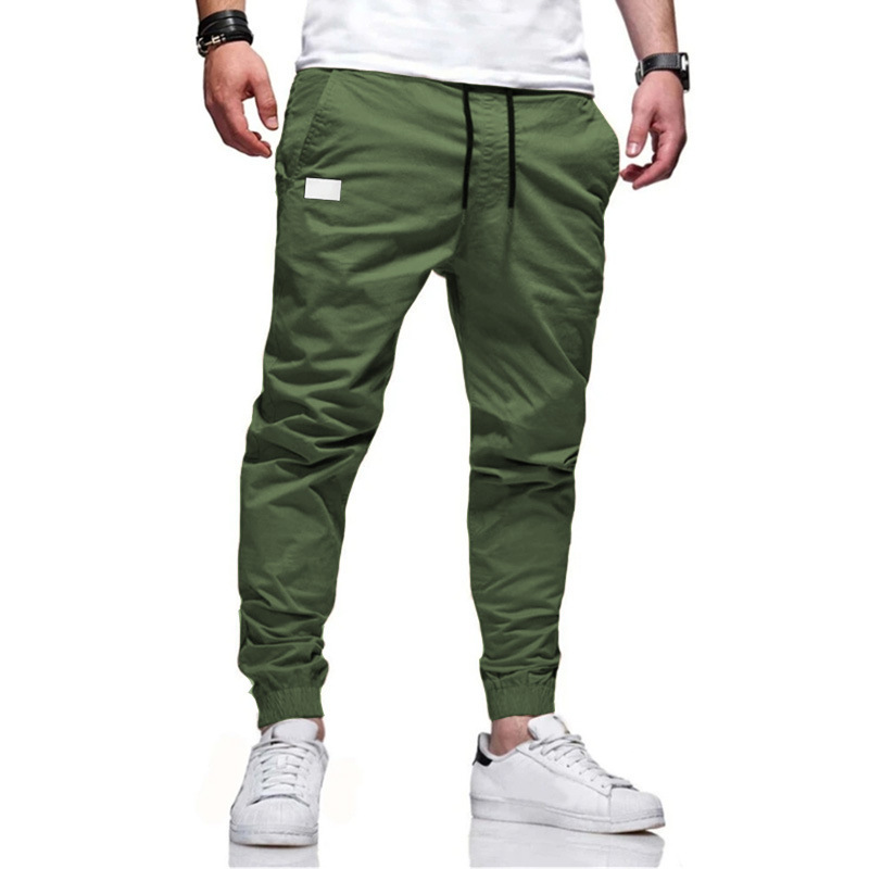 Vêtements pour hommes en tissu tissé Nouvelle explosion de couleur unie décontractée spot ordinaire pantalons pour jeunes pantalons décontractés à la taille